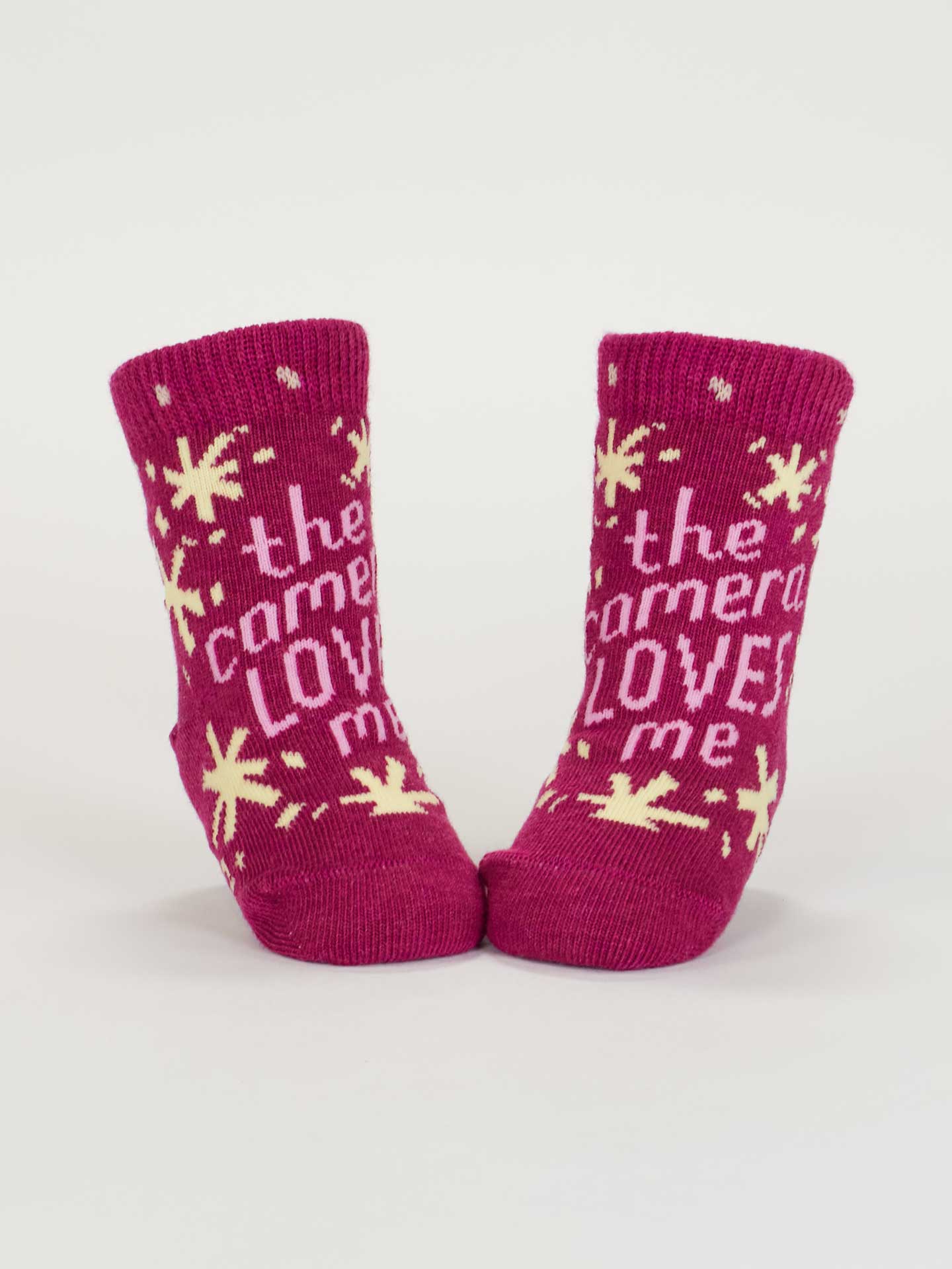 SW232 The Camera Loves Me/ I Got One Brewing Baby Socks