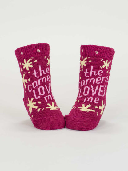 SW232 The Camera Loves Me/ I Got One Brewing Baby Socks